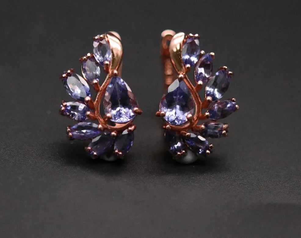 Tanzanite earrings, Natural gemstone, Clasp earrings, Precious gemstones, Fine jewelry, Tanzanite jewelry, Gemstone earrings, Luxury earrings, Sterling silver, December birthstone, Blue-violet gemstone, Statement jewelry, Elegant earrings, Rare gemstone, Handcrafted jewelry,