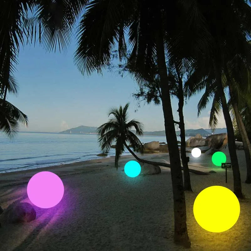 Waterproof RGB color-changing LED ball lights illuminating a beach at dusk