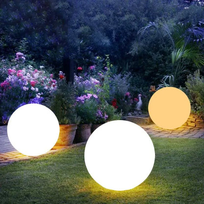 Waterproof RGB Color-Changing LED Ball Lights illuminating garden, ideal for outdoor settings like patios and pools.